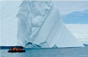  ??  ?? Top: Built in 1982, the diesel- electric icebreaker has transporte­d crew and adventurou­s passengers hundreds of thousands of miles through the icy waters of the Arctic and Antarctica. Middle: Clothes and fish are hung out to dry in Qaanaaq, formerly...