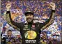  ?? STEVE HELBER - AP ?? Martin Truex Jr., celebrates winning the NASCAR Cup series auto race in Richmond, Va., Saturday night.