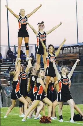  ?? Westside Eagle Observer/MIKE ECKELS ?? The Lion cheer team finishes its halftime routine in style Aug. 28 during the Gravette-Vian (Okla.) varsity football contest at Lion Stadium.