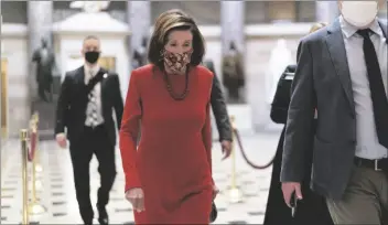  ?? J. SCOTT APPLEWHITE/AP ?? LEFT: Speaker of the House Nancy Pelosi, D-Calif., walks to the chamber to condemn the actions of Rep. Paul Gosar, R-Ariz., who tweeted an animated video that depicted him striking Rep. Alexandria Ocasio-Cortez, D-N.Y., with a sword, on Capitol Hill in Washington Wednesday.