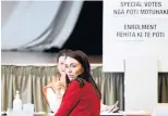  ?? PHOTOS: GETTY IMAGES ?? Two ticks . . . Major party leaders Judith Collins (left) and Jacinda Ardern cast early votes in the general election.