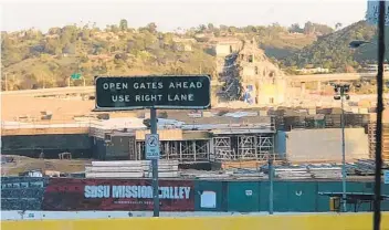  ?? KIRK KENNEY U-T ?? View from Friars Road on Monday evening as work continued on tearing down last section of the stadium.