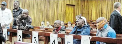  ?? Picture: SUE MACLENNAN ?? DANGEROUS CRIMINALS: Francis Chitiyo, Trymore Chauke, Misheck Chauke, Simba Misinge, Nhamo Muyambo and Abraham Moyane during an adjournmen­t when judge Gerard Bloem convicted them on charges of conspiracy to poach rhinos in the Makhanda high court on September 30. All except Misheck Chauke escaped from Waainek Correction­al Facility in Makhanda early on Tuesday October 18.