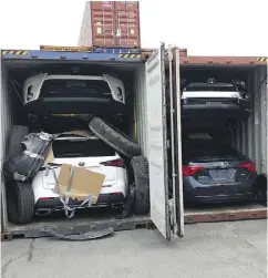  ?? INSURANCE BUREAU OF CANADA ?? Four stolen vehicles are seen in shipping containers in Montreal, one of the key jumping-off points for North American vehicles taken by criminal gangs and destined for the Mideast, Asia or West Africa.