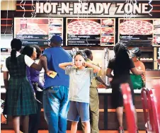  ??  ?? Are you ready to step into the ‘Hot and Ready’ zone? Inside the newly opened Little Caesars.