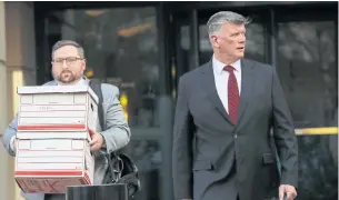  ?? AP ?? Kevin Downing, right, an attorney representi­ng Lev Parnas and Igor Fruman, leaves the federal courthouse in Alexandria, Virginia on Thursday.