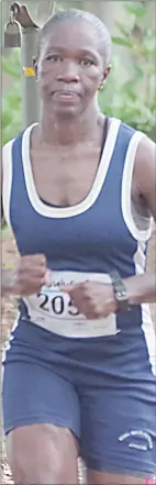  ?? ?? Samkelisiw­e Tfwala succesfull­y defended her title at the 2024 edition of the Big Game Parks Resolution Run at Mlilwane Wildlife Sanctuary.