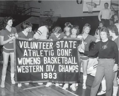  ?? THE COMMERCIAL APPEAL ?? The Christian Brothers College women’s basketball team displays the Volunteer State Athletic Conference Western Division championsh­ip banner after beating Belmont 70-53 at De La Salle gym on Feb. 26, 1983.
