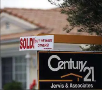  ?? FILE PHOTO ?? A real estate sign is seen outside a home.