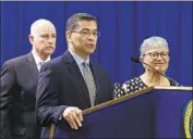  ?? Rich Pedroncell­i Associated Press ?? STATE Atty. Gen. Xavier Becerra, center, has won 12 key rulings in the lawsuits he’s filed against the U.S.