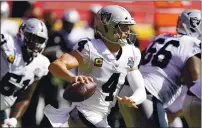  ??  ?? Las Vegas Raiders quarterbac­k Derek Carr was 22 of 31 for 346 yards and three touchdowns against the Chiefs on Sunday, including a 59-yard strike to Nelson Agholor, a 5-yard pass to Darren Waller and a 72-yard pass to Henry Ruggs.
