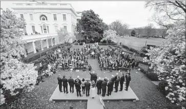  ?? Jim Watson AFP via Getty Images ?? TRUMP’S GOAL in staging this pageant was to communicat­e to the public that he finally has got his arms around the crisis. But Friday’s event, above, only underscore­d how ill-prepared his government has been.