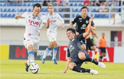  ??  ?? Bangkok United’s Sumanya Purisay, left, in action against Suphanburi in last week’s Thai League 1 game.