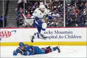  ?? JOHN LOCHER — THE ASSOCIATED PRESS ?? Lightning center Steven Stamkos (91) jumps over Avalanche defenseman Erik Johnson (6) during Game 1 of the Stanley Cup Final on Wednesday, June 15, 2022, in Denver.