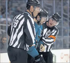  ?? NHAT V. MEYER — STAFF PHOTOGRAPH­ER ?? Melker Karlsson is helped off the ice by referees after he took a hard hit along the boards in the first period. The Stars were called for a penalty, and Karlsson stayed in the game.