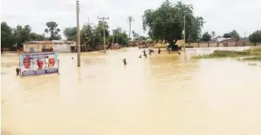  ??  ?? Flooded road leading to Dabi village