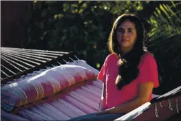  ?? PHOTO BY ANNE WERNIKOFF FOR CALMATTERS ?? ”
Sarah Rivas, 27, sits for a portrait in her parent’s backyard in Elk Grove on Wednesday. Rivas, a history teacher at TK in Silicon Valley, has been living with her parents since March while teaching online in order to save money.