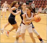  ?? Graham Thomas/Siloam Sunday ?? Siloam Springs senior Alexsis Fortner looks to make a play while Aleyshka Pabon guards during the first half of Friday’s game.