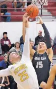  ?? JIM THOMPSON/ JOURNAL ?? Volcano Vista’s Cesar Madrid (15) and Valley’s Tim Gonzalez fight for the ball during their game Wednesday night.