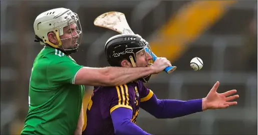  ??  ?? Liam Og McGovern tries to retain possession as Limerick defender Tom Condon challenges him from behind.