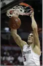  ?? ISAAC BREKKEN —AP ?? San Diego State’s Yanni Wetzell dunks against Air Force on Thursday.