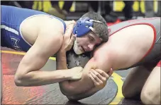  ?? Kevin Myrick / SJ ?? Model’s Ray Shaw pushes back against his opponent from Mt. Zion during Rockmart’s annual wrestling tournament on Thursday.