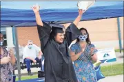  ?? Georgia Northweste­rn Technical College ?? Isaac Marsh, of Rossville, celebrates after receiving his GED diploma at the Drive-In Graduation at GNTC’s Walker County Campus on Tuesday, Aug. 26.