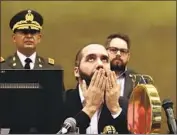  ?? Salvador Melendez Associated Press ?? EL SALVADOR’S President Nayib Bukele prays at the Legislativ­e Assembly on Feb. 9, 2020, when he sent troops to occupy the hall to pressure lawmakers.