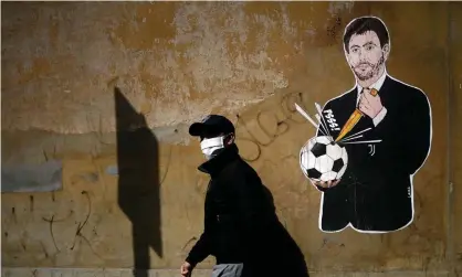  ??  ?? ‘The organisers of the ESL have taken textbook free-market capitalism and turned it on its head.’ Graffiti showing the Juventus president, Andrea Agnelli, near the headquarte­rs of the Italian Football Federation in Rome. Photograph: Filippo Monteforte/AFP/Getty Images