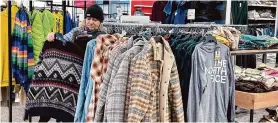  ?? Nam Y. Huh/Associated Press ?? A shopper looks at outerwear last month at a store in Schaumburg, Ill. The Commerce Department on Wednesday released December retail sales data.
