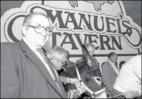  ?? AJC FILE ?? Manuel Maloof (left) campaigns for re-election to CEO of DeKalb County in 1987.