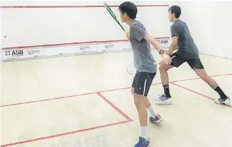  ??  ?? Ng Eain Yow (left) and Sanjay Singh Chal during their training session at the Sarawak Squash Centre, Petra Jaya.