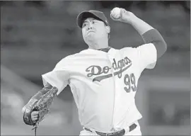  ?? Alex Gallardo Associated Press ?? HYUN-JIN RYU pitches seven shutout innings against Colorado, giving up four hits while striking out five and walking none for only his second win since April.