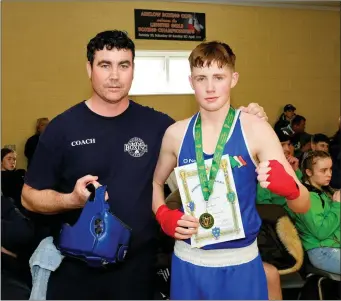  ??  ?? Coach Ben Lynch and B4 60kg champion Cole Byrne from Enniskerry Boxing Club.
