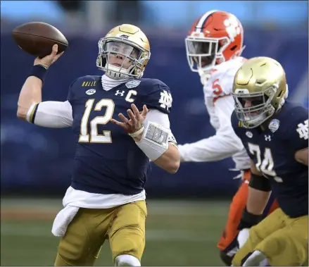  ?? JEFF SINER - THE ASSOCIATED PRESS ?? Notre Dame quarterbac­k Ian Book throws a pass against Clemson during the Atlantic Coast Conference championsh­ip NCAA college football game, Saturday, Dec. 19, 2020, in Charlotte, N.C.