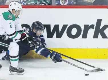  ?? BRIAN DONOGH/POSTMEDIA NETWORK FILES ?? Winnipeg Jets right winger Patrik Laine, right, shown battling Dallas Stars defenceman Dan Hamhuis for the puck, patterned his game after Washington superstar Alex Ovechkin. The two face each other Tuesday.