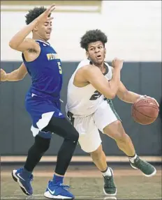  ?? Steph Chambers/Post-Gazette ?? Allderdice’s Tyler Williams, right, scored 17 points off 7-of-10 shooting from the field in the Dragons’ 80-45 victory against visiting Westinghou­se on Friday.