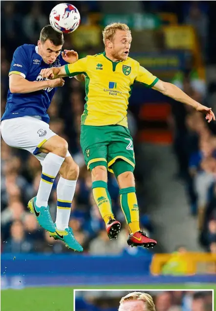  ?? — Reuters ?? Toffees keep rising: Everton’s Seamus Coleman heading the ball away from Norwich’s Alex Pritchard in the League Cup third round match at Goodison Park on Tuesday. Inset: Ronald Koeman.