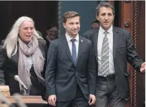  ?? JACQUES BOISSINOT/CP ?? Gabriel Nadeau-Dubois enters the National Assembly with Solidaire MNA Manon Masse, left, and Amir Khadir on Tuesday.
