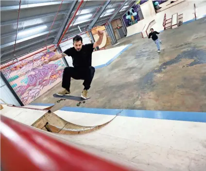  ??  ?? Richard Dalton, 29, rides inside Society Skatepark, a joint venture with Contact Skateboard Shop in the Broad Avenue Arts District which held its soft opening on Dec. 20, 2018. JOE RONDONE/THE COMMERCIAL APPEAL