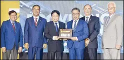  ??  ?? DBP officials led by first vice president Daniel Gonzales (3rd from left) and executive vice president Benel Lagua (fourth from left) receive the Nation Builder Award from officials of Quantity Solutions Inc. and the American Chamber of Commerce during ceremonies held at the Okada Manila in Parañaque City.