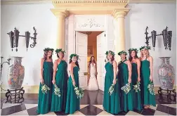  ??  ?? The beautiful bride is flanked by her bridesmaid­s (from left) Madina Baxall, Traci Stewart, Lindsey Chang, Sandy Lee, Jodi Henriques, Danhee Bhakta and Stephanie Gatey.