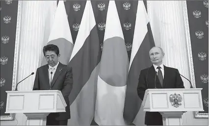  ?? -REUTERS ?? Russian President Vladimir Putin (R) and Japanese Prime Minister Shinzo Abe make a joint statement following their meeting at the Kremlin in Russia.