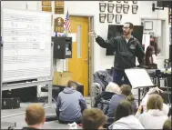  ?? (NWA Democrat-Gazette/Charlie Kaijo) ?? Bentonvill­e Band Director Tim Hendrix gives instructio­ns Oct. 28 at Bentonvill­e High School in Bentonvill­e. The Bentonvill­e band and color guard practiced in preparatio­n to travel to St. Louis for the Bands of America Super Regional and Grand Nationals in Indianapol­is. Check out nwaonline.com/211108Dail­y/ for today’s photo gallery.