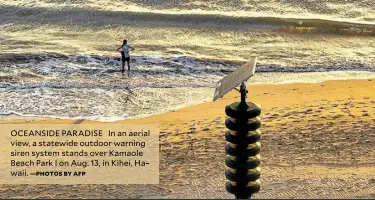  ?? —PHOTOS BY AFP ?? OCEANSIDE PARADISE In an aerial view, a statewide outdoor warning siren system stands over Kamaole Beach Park I on Aug. 13, in Kihei, Hawaii.