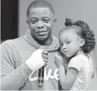  ?? MARK ZALESKI/THE TENNESSEAN ?? James Shaw Jr. and his daughter.