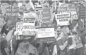  ?? SAUL LOEB, AFP/GETTY IMAGES ?? Demonstrat­ors rally outside the Supreme Court on Wednesday as the court heard oral arguments on a Texas abortion law.