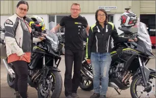  ??  ?? Jenny Lee and Julia Yu pictured with, AMI manager, David Ryanhart where they purchased two Honda CB 500X motorcycle­s