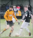  ?? Photograph: Abrightsid­e Photograph­y ?? Fort’s Ronan McBride does his best to keep possession in difficult conditions.