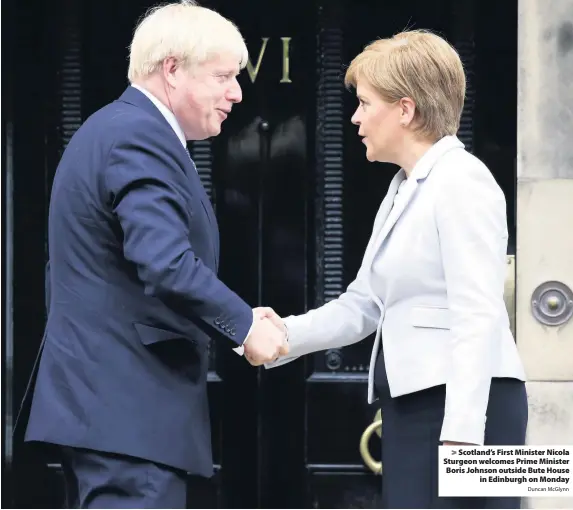  ?? Duncan McGlynn ?? > Scotland’s First Minister Nicola Sturgeon welcomes Prime Minister Boris Johnson outside Bute House in Edinburgh on Monday